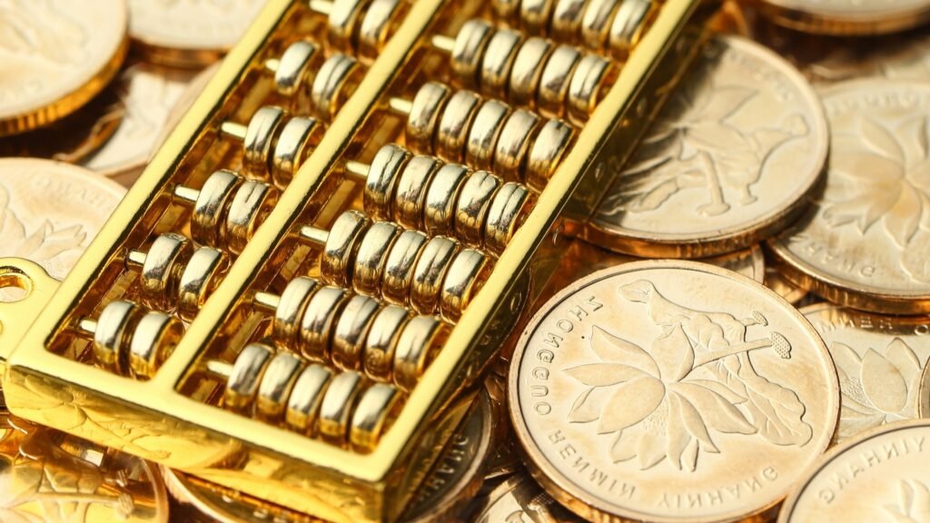 Golden Abacus with Chinese rmb gold coins as background